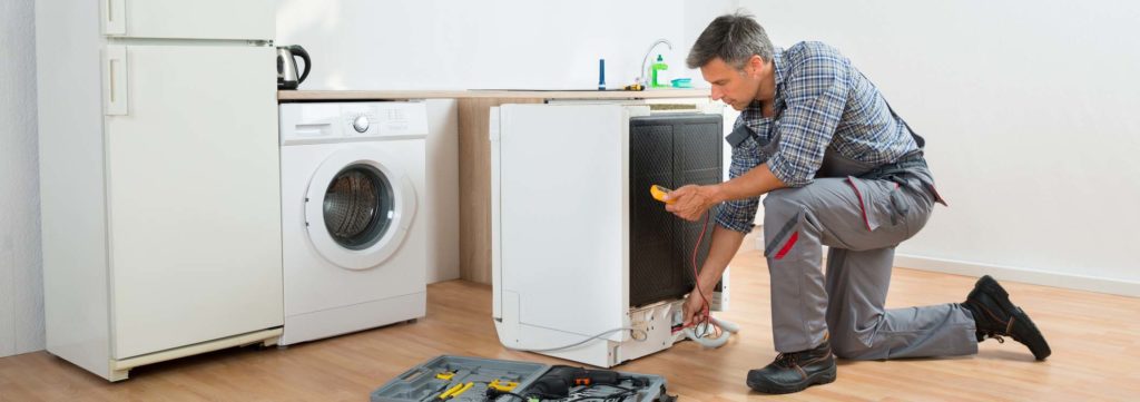 Technician Checking Dishwasher With Digital Multimeter